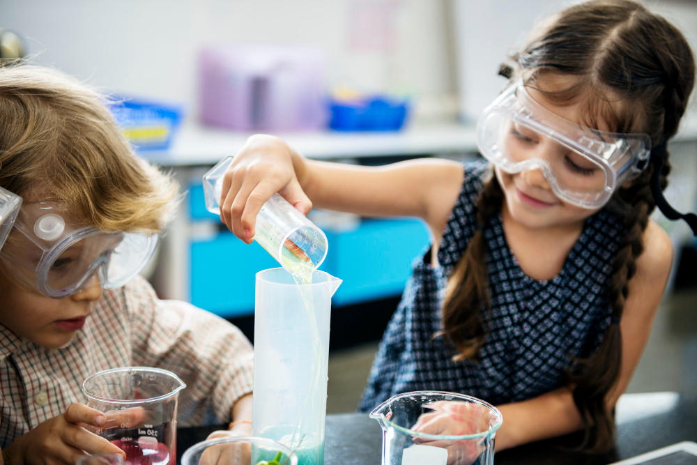138144 image Young children collaborating on hands-on building and scientific exploration during a STEM lab activity.